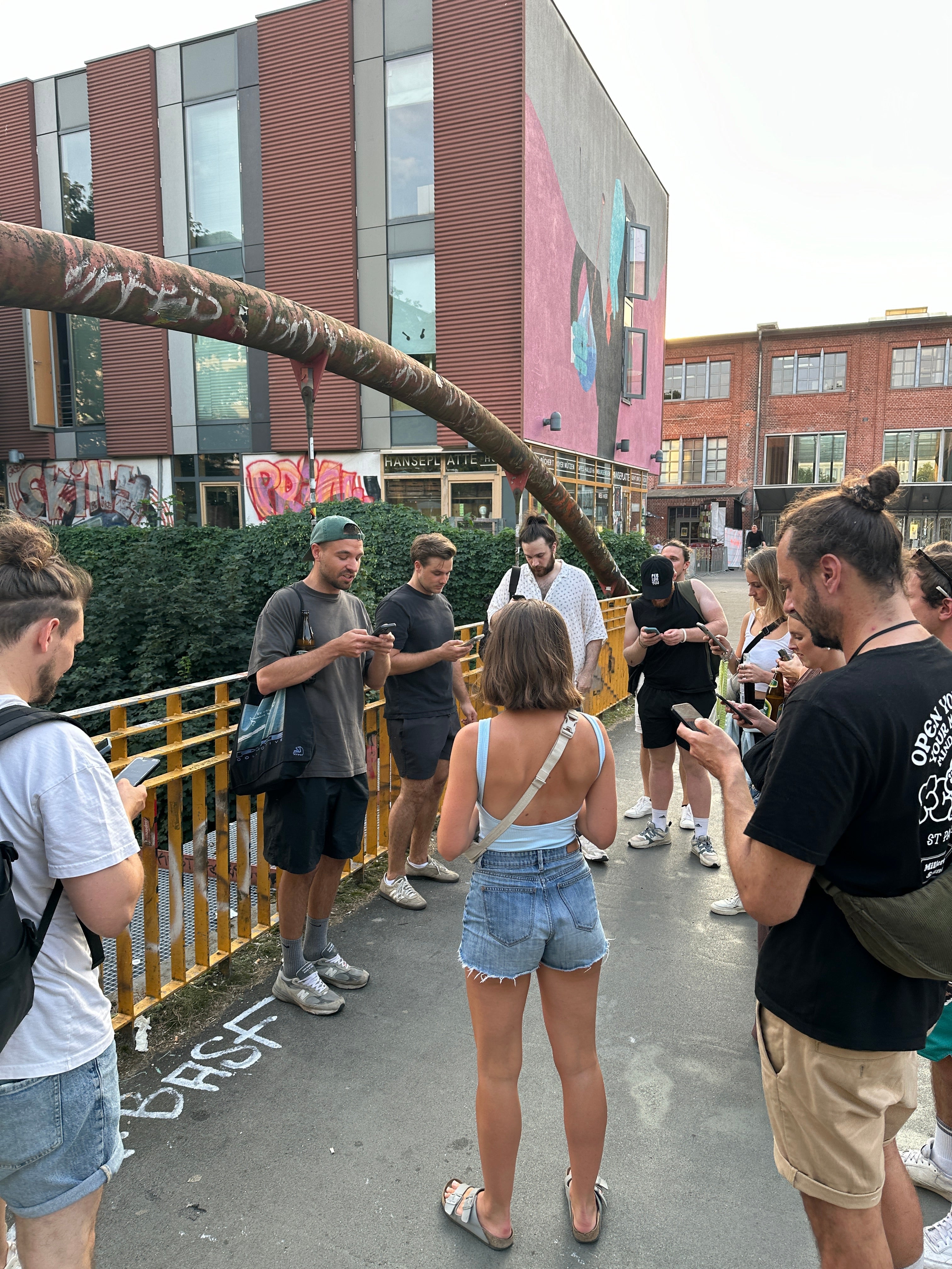 Team exploring murals during an interactive street art tour for teams in the city center