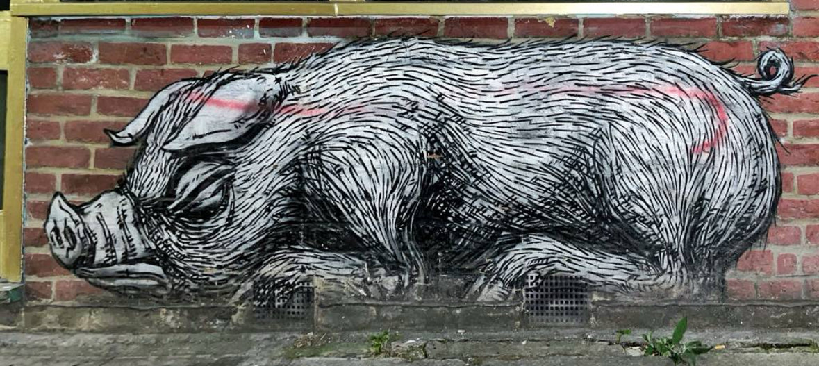 Colorful mural captured during the London Street Art Tour in Shoreditch, featuring iconic urban artworks.