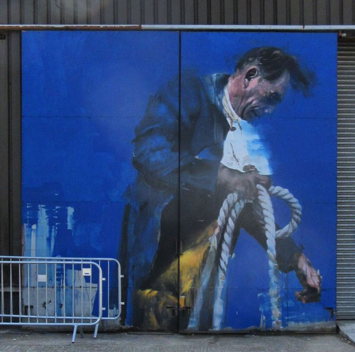 Street Art Game app guiding a group through the London Street Art Tour with murals in the background of Shoreditch.