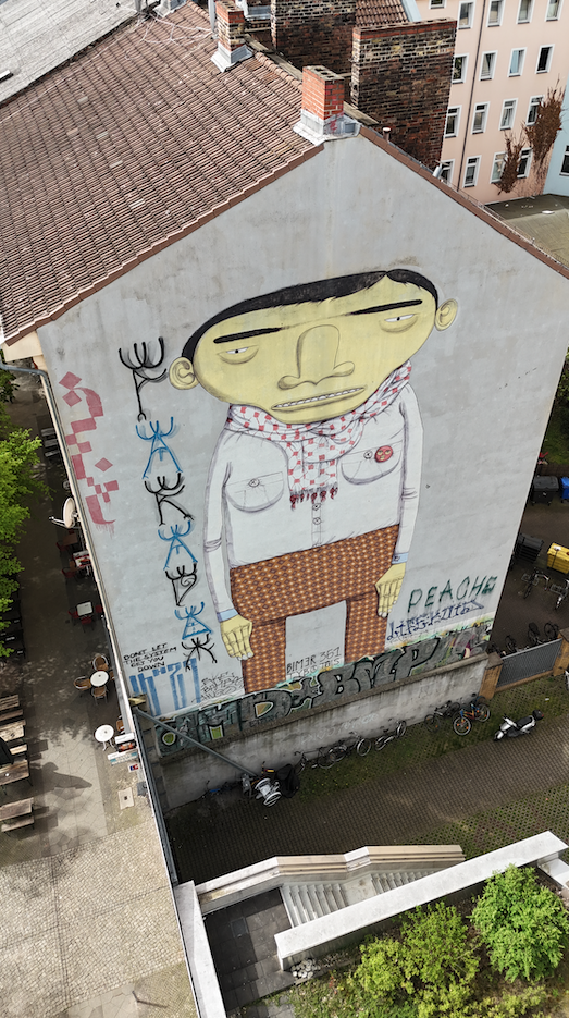 Team exploring colorful murals during the Berlin Team Building Street Art Walk in Kreuzberg.