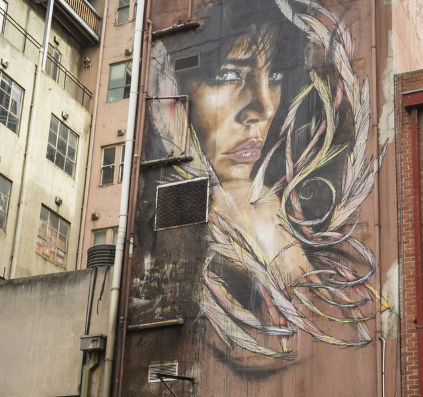 Melbourne Team Building Street Art Walk — creative group celebrating a mission streak near Napier Street