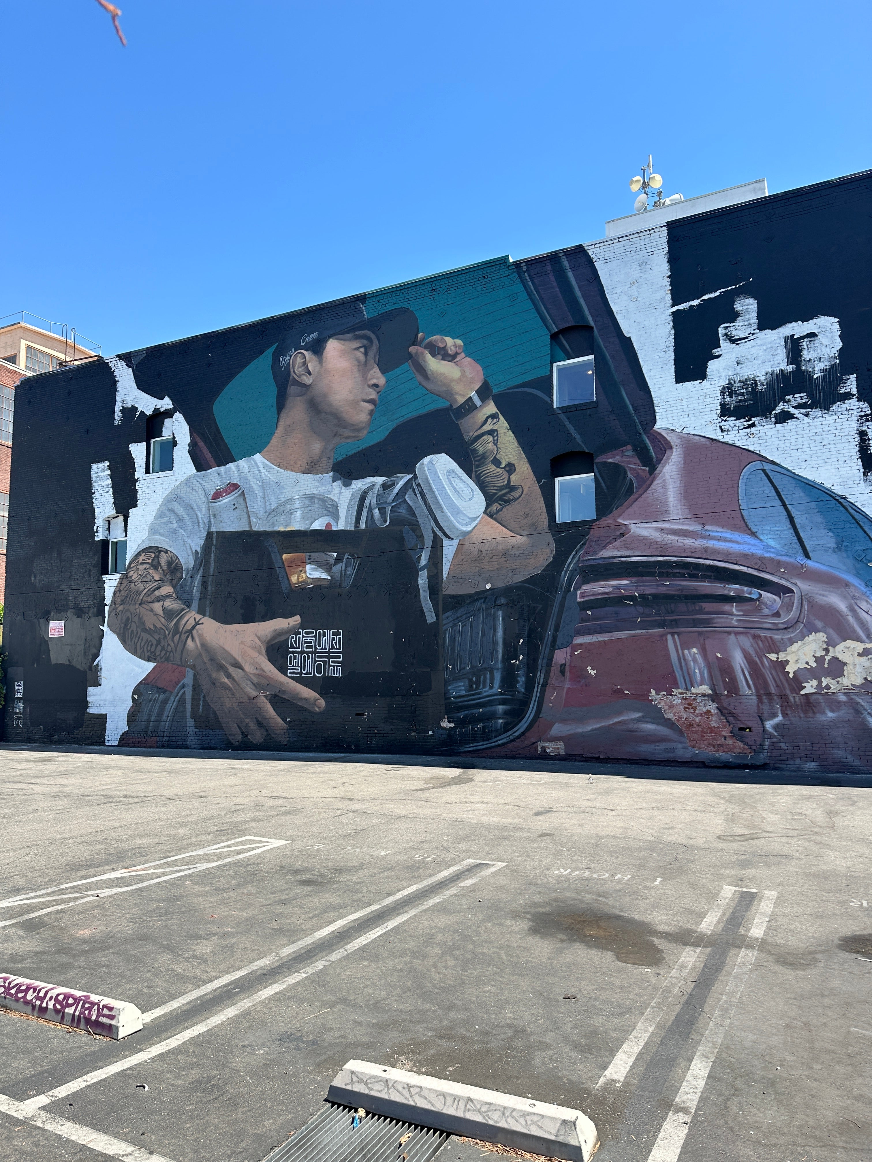 Small group doing a casual city walk Los Angeles with vibrant Arts District murals