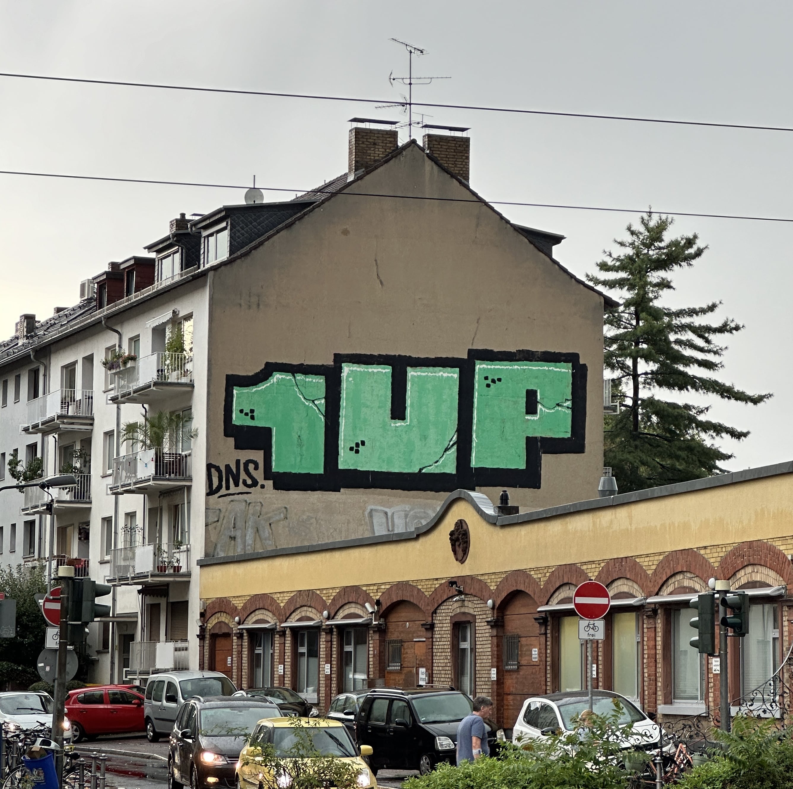 Street Art Tour Frankfurt featuring the urban graffiti 1UP Roll-Up in the Ostend district of Frankfurt.