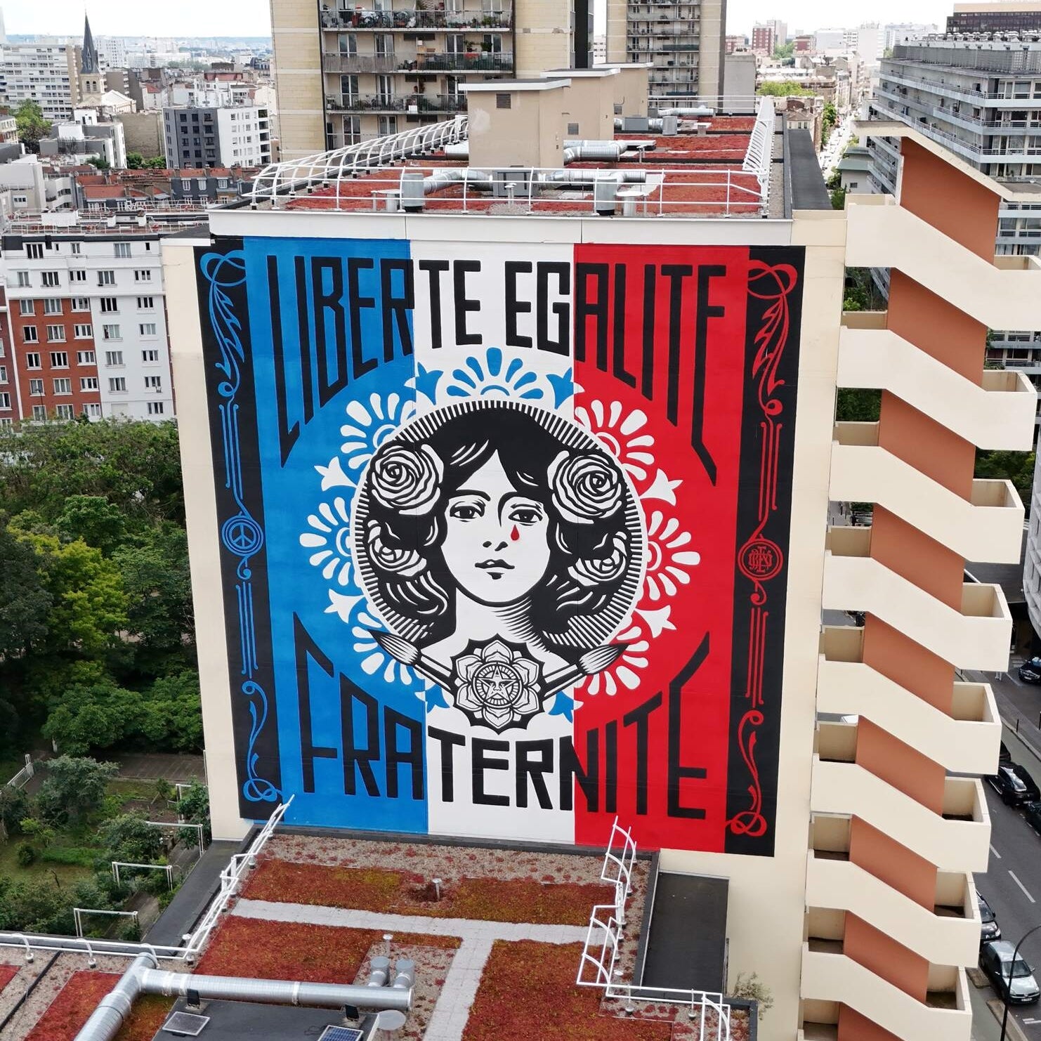 Street Art Tour Paris featuring the urban art piece 'Liberty, Equality, Fraternity' by Obey aka Shepard Fairey in the 13th arrondissement of Paris.