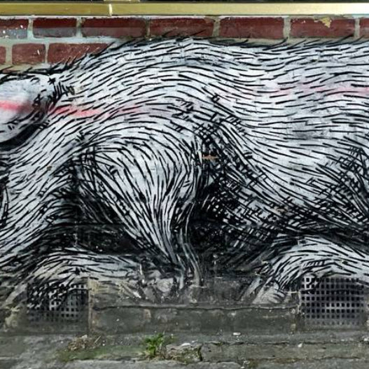 Colorful mural captured during the London Street Art Tour in Shoreditch, featuring iconic urban artworks.