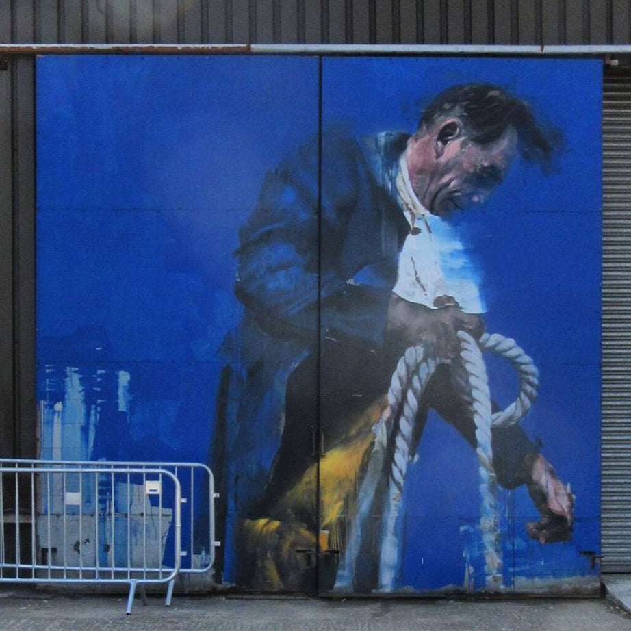 Street Art Game app guiding a group through the London Street Art Tour with murals in the background of Shoreditch.