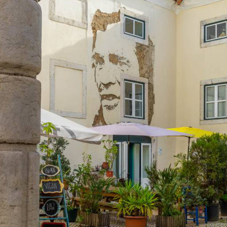 Close-up of a Vhils chiseled portrait on the Street Art Tour Lisbon route