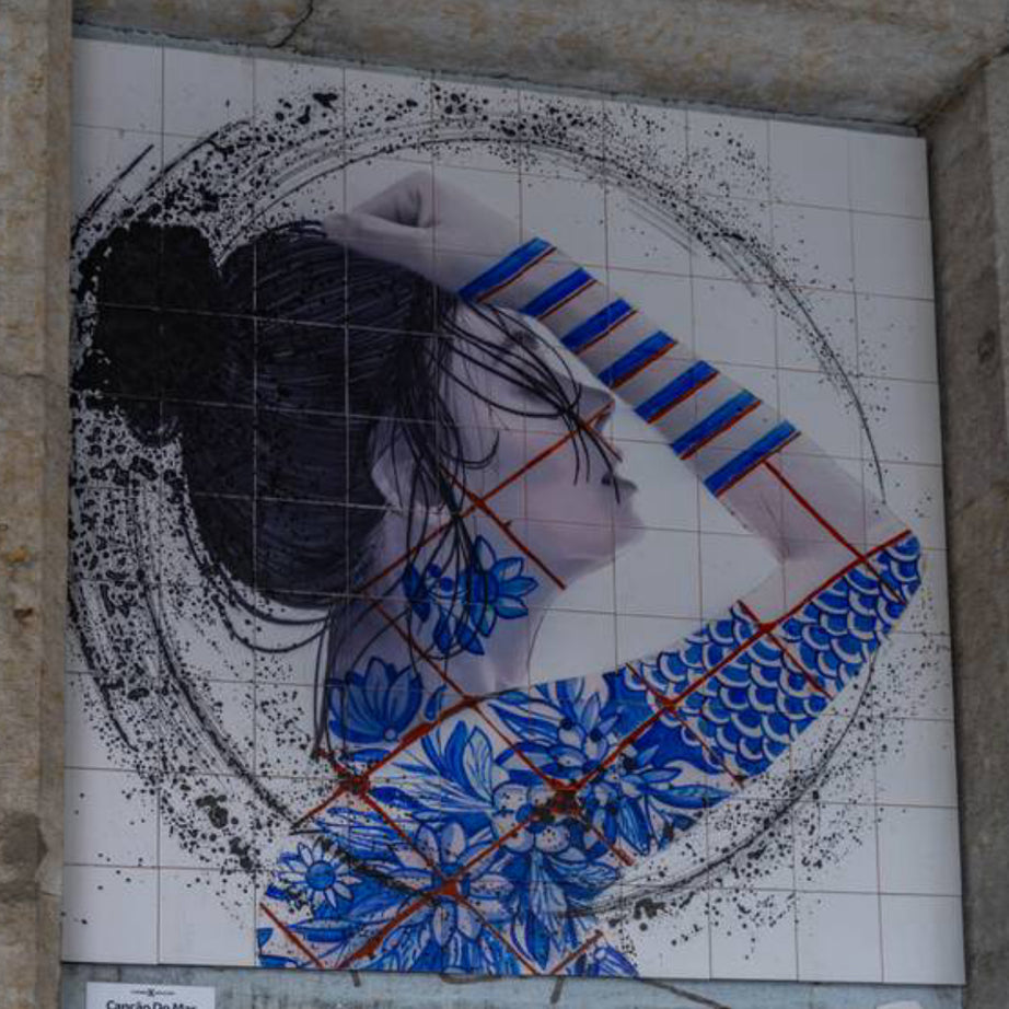 Class Trip Lisbon Street Art Tour — spotting stencil details in Alcântara side streets