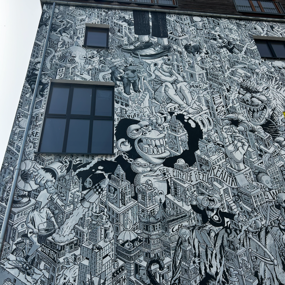 Coworkers enjoying a coffee break at Five Elephant during the Street Art Tour Berlin.