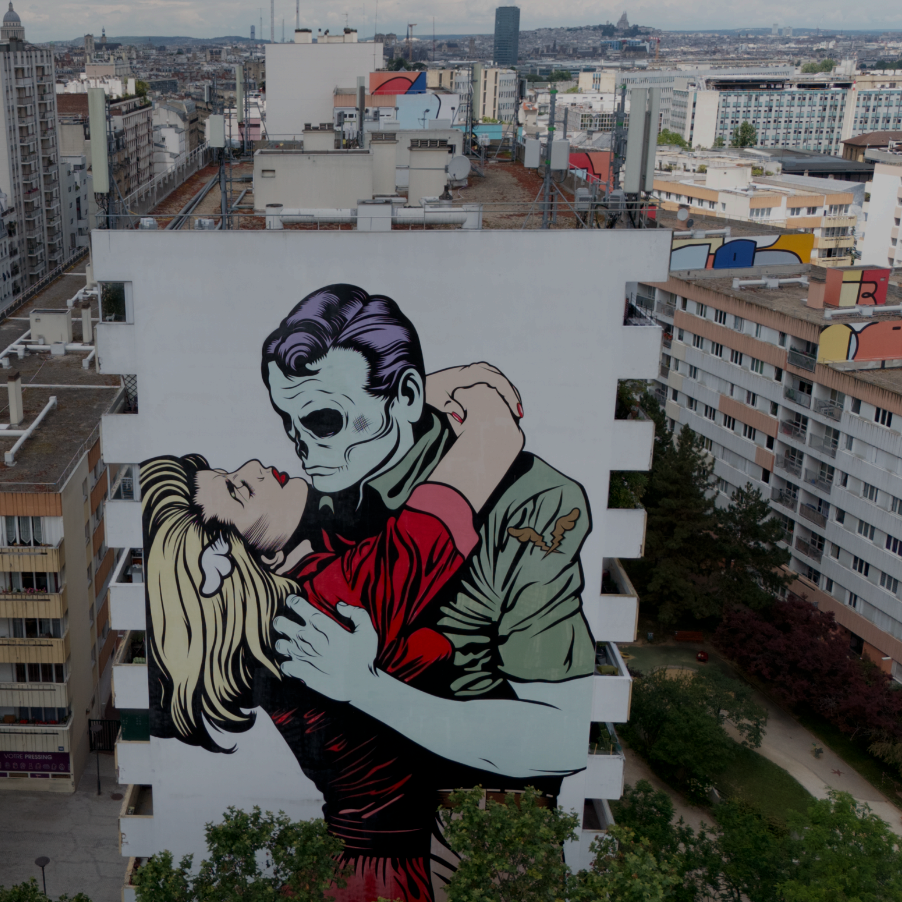Team exploring colorful murals during the Paris Team Building Street Art Walk in the 13th arrondissement