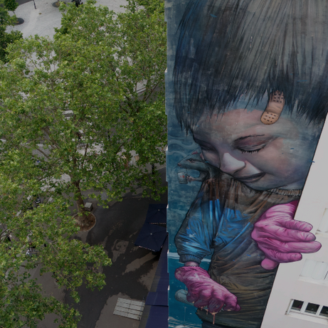 Paris Team Building Street Art Walk group photo at Boulevard Vincent Auriol mural