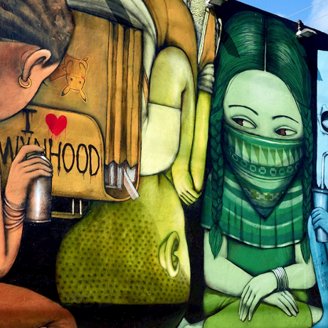 Team selfie at a colorful wall during the Street Art Tour Miami city walk