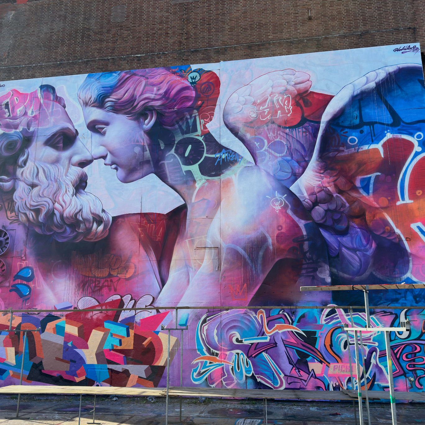 Coworkers exploring graffiti walls and installations at STRAAT Museum during the Amsterdam Team Building Street Art Walk.