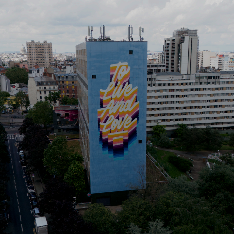 Class Trip Paris Street Art Tour — group photo with high-rise mural backdrop in the 13th