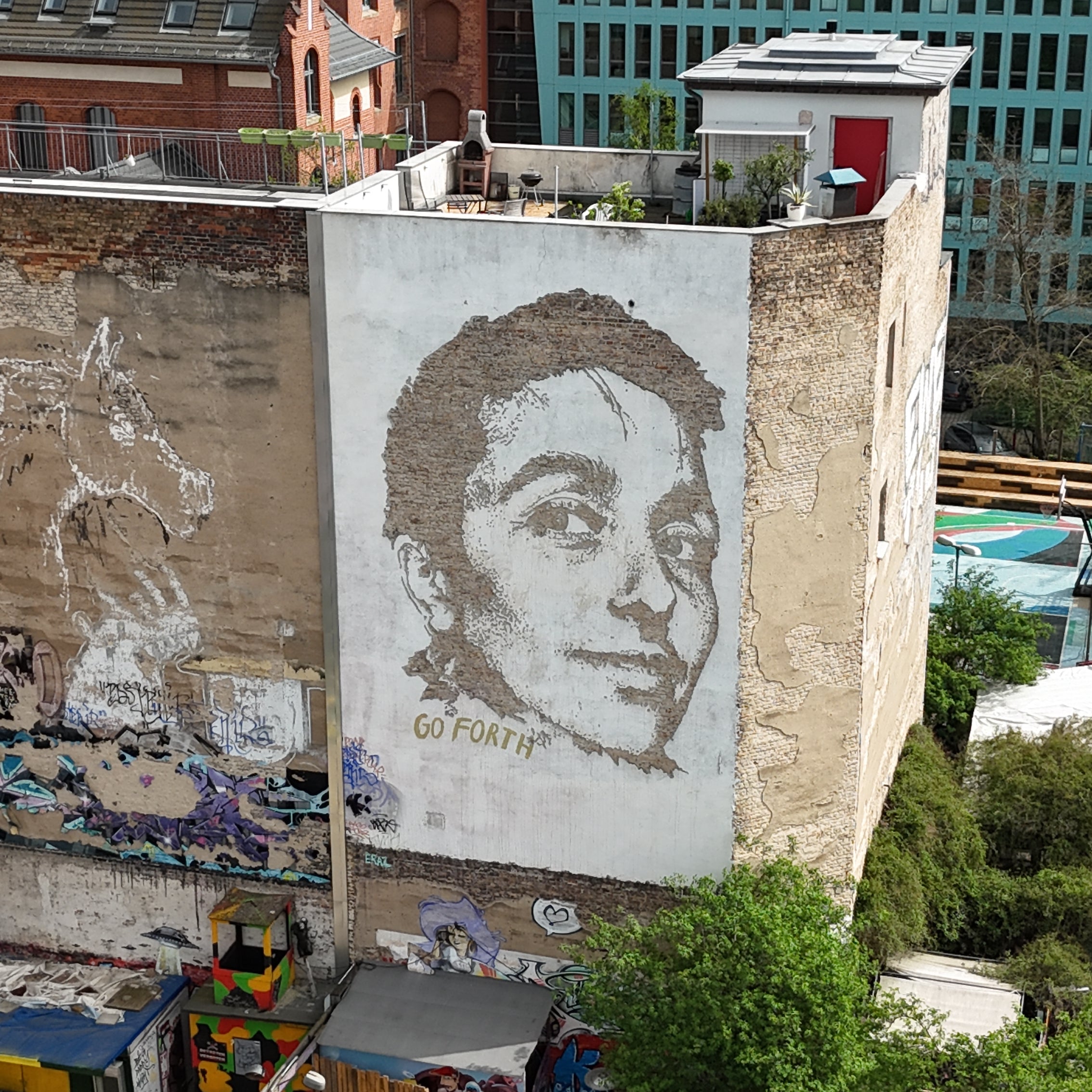 Close-up of a Vhils chiseled portrait on the Street Art Tour Berlin route