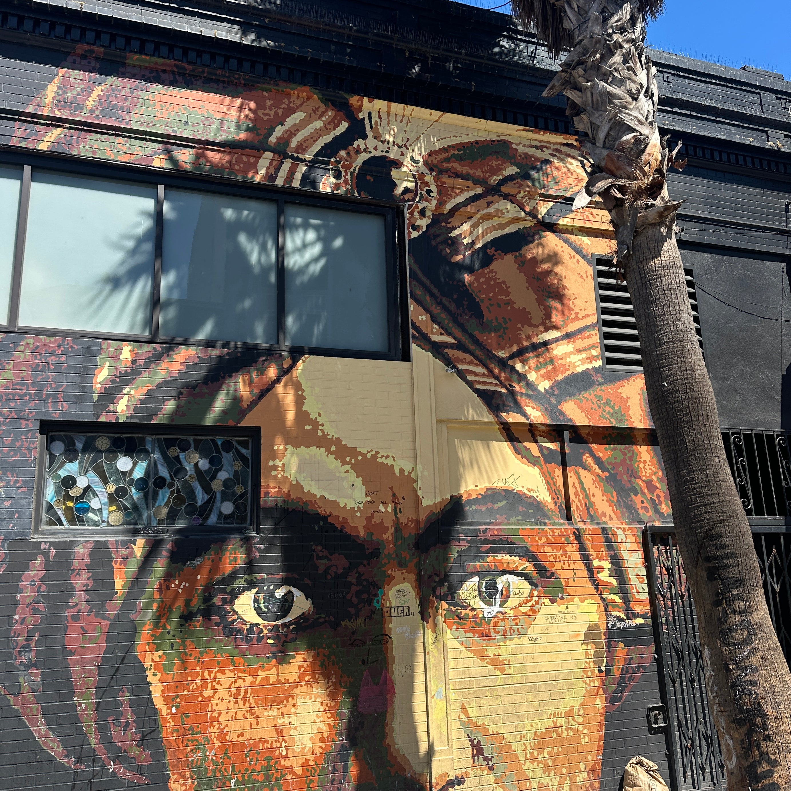 mall group doing a casual graffiti tour San Francisco with bold Mission murals