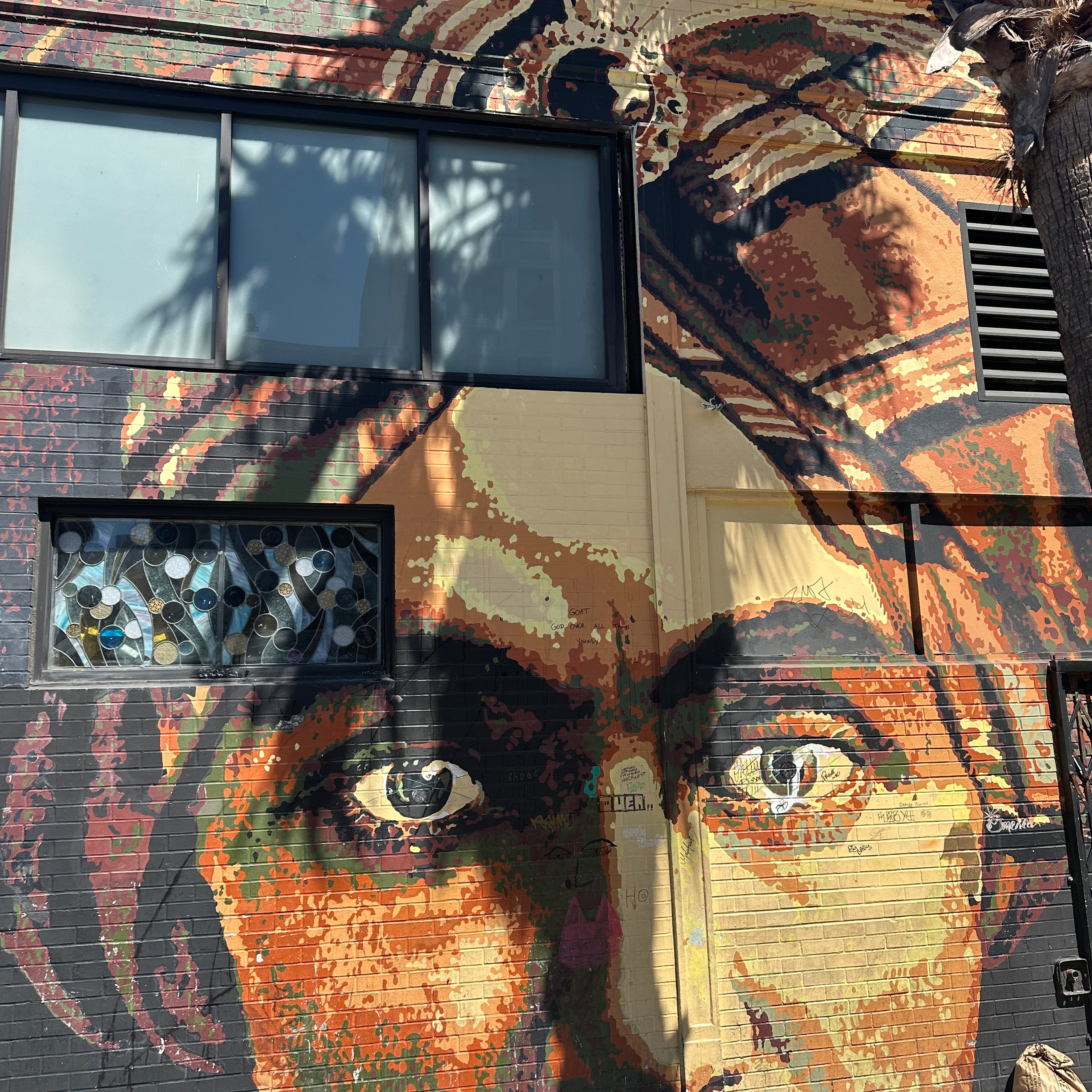 Team capturing photos of vibrant Mission District murals on the Street Art Tour San Francisco with the Street Art Game app.