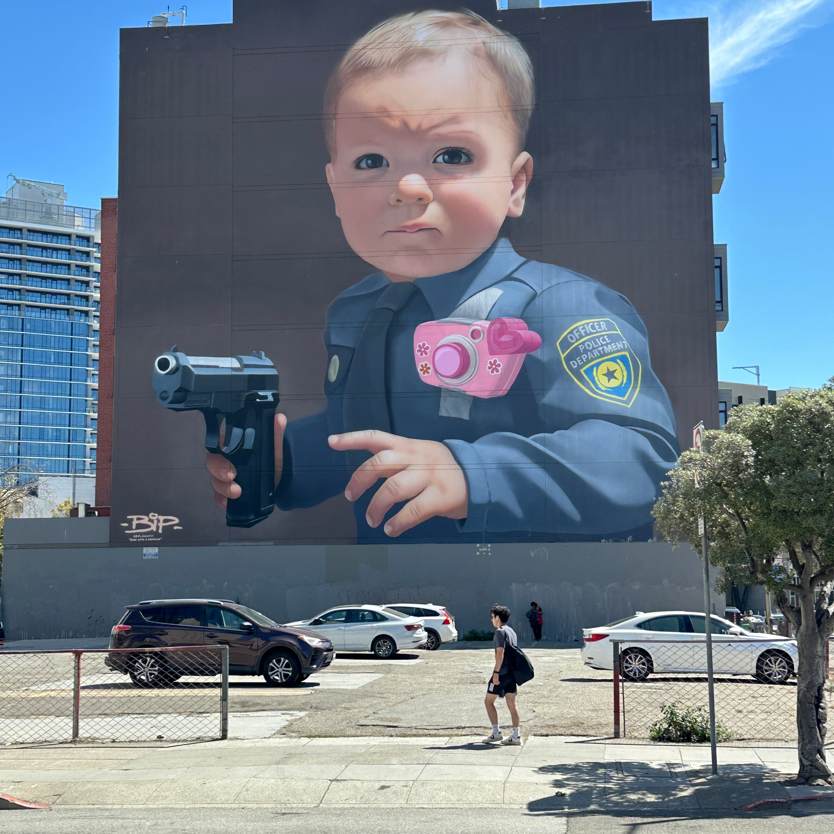 Group selfie at a colorful wall during the Street Art Tour San Francisco city walk