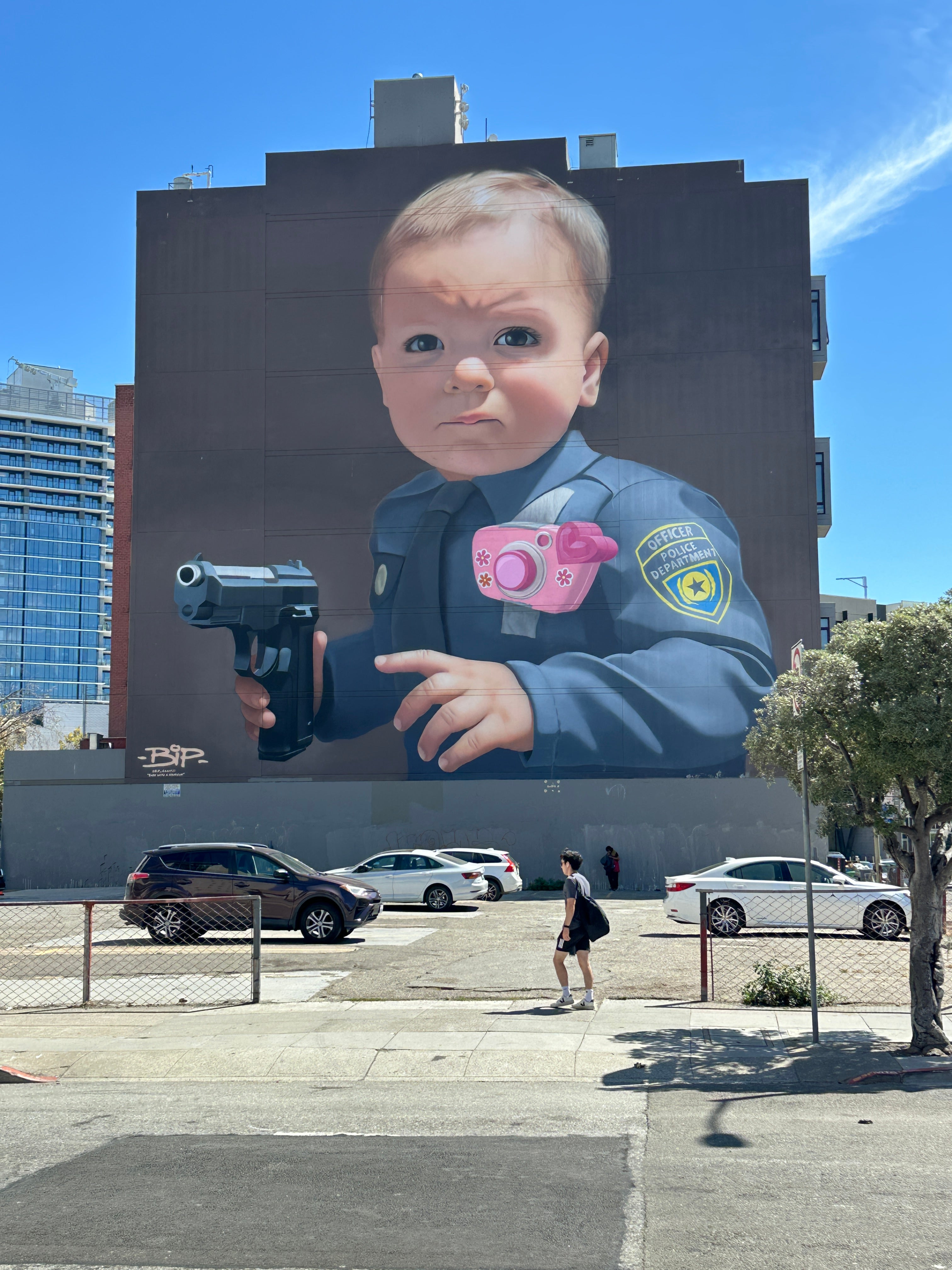 Group selfie at a colorful wall during the Street Art Tour San Francisco city walk