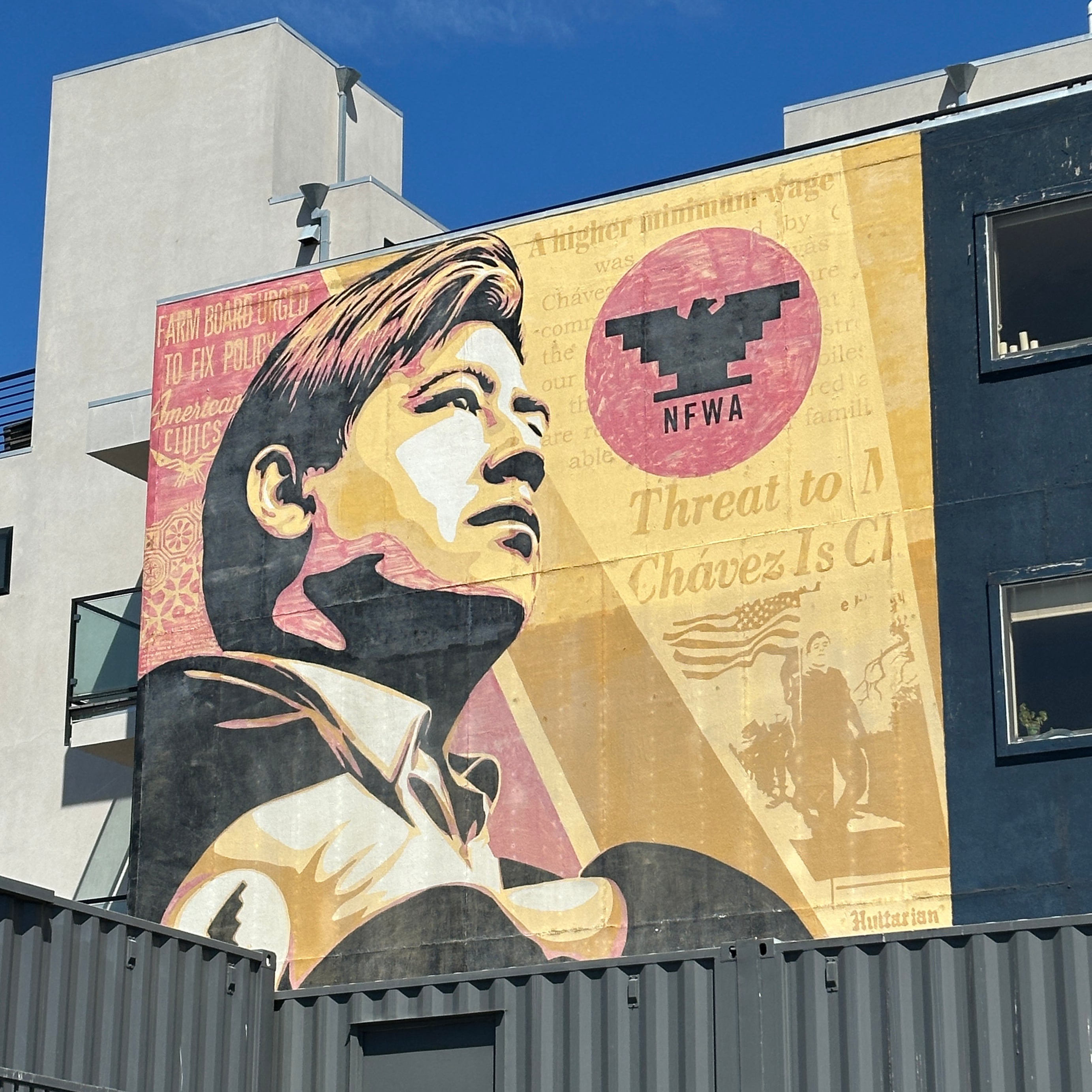 Group exploring Shepard Fairey’s Obey Giant mural on the Street Art Tour San Francisco near Clarion Alley.
