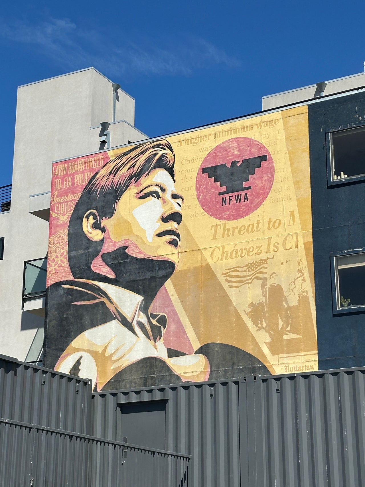 Group exploring Shepard Fairey’s Obey Giant mural on the Street Art Tour San Francisco near Clarion Alley.