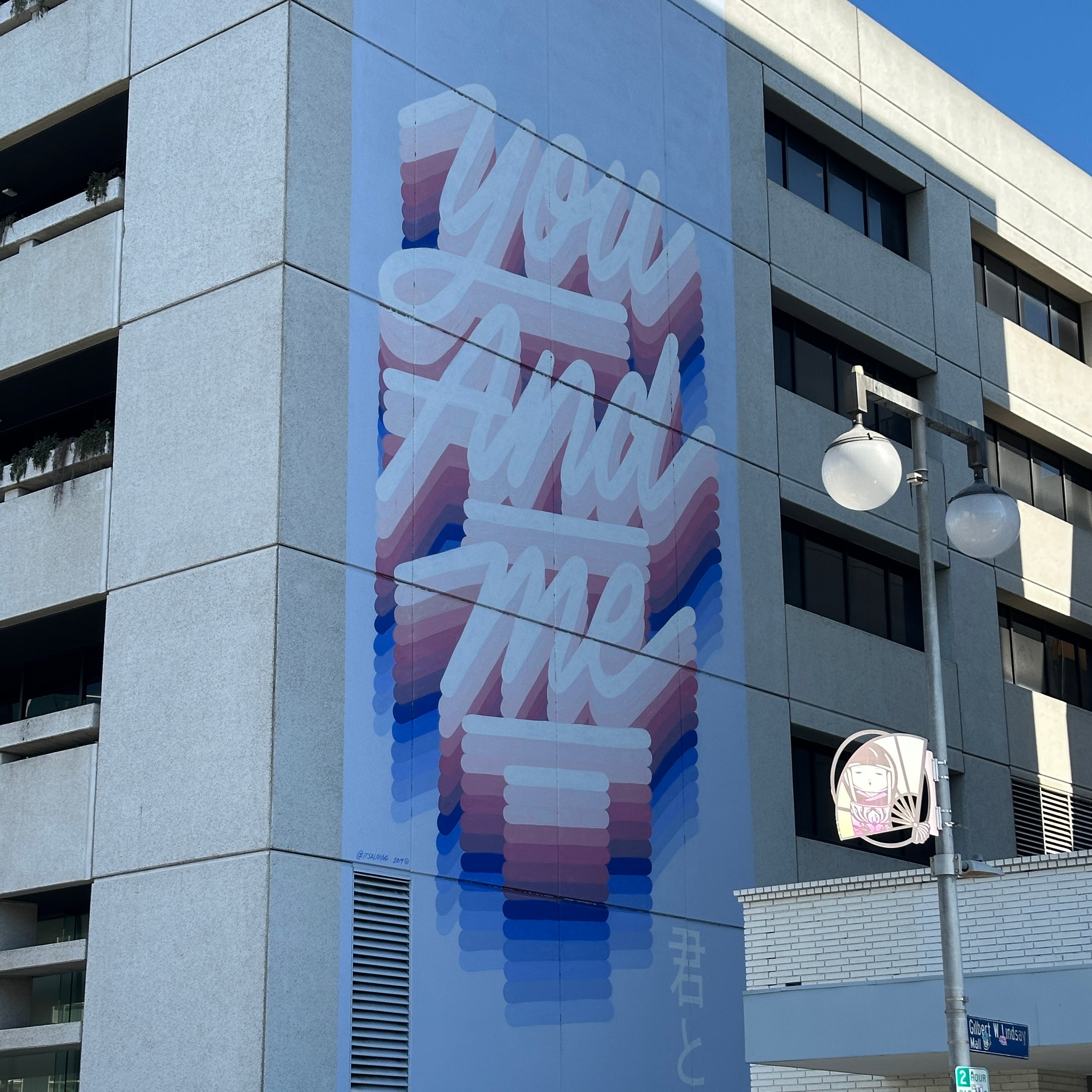 Team competing in street art challenges while exploring murals by Tristan Eaton on the Street Art Tour Los Angeles.