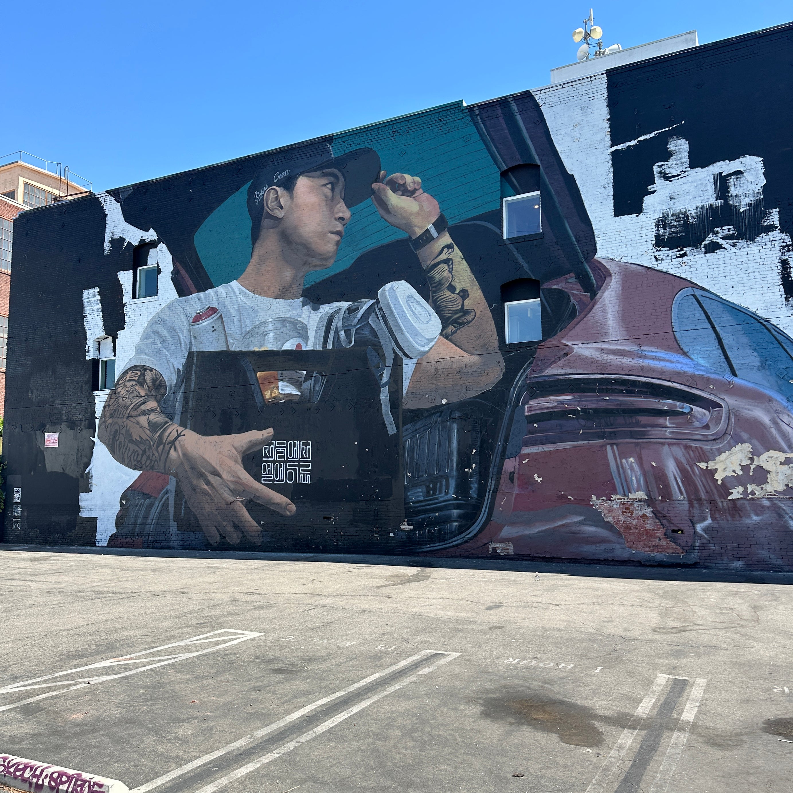 Small group doing a casual city walk Los Angeles with vibrant Arts District murals