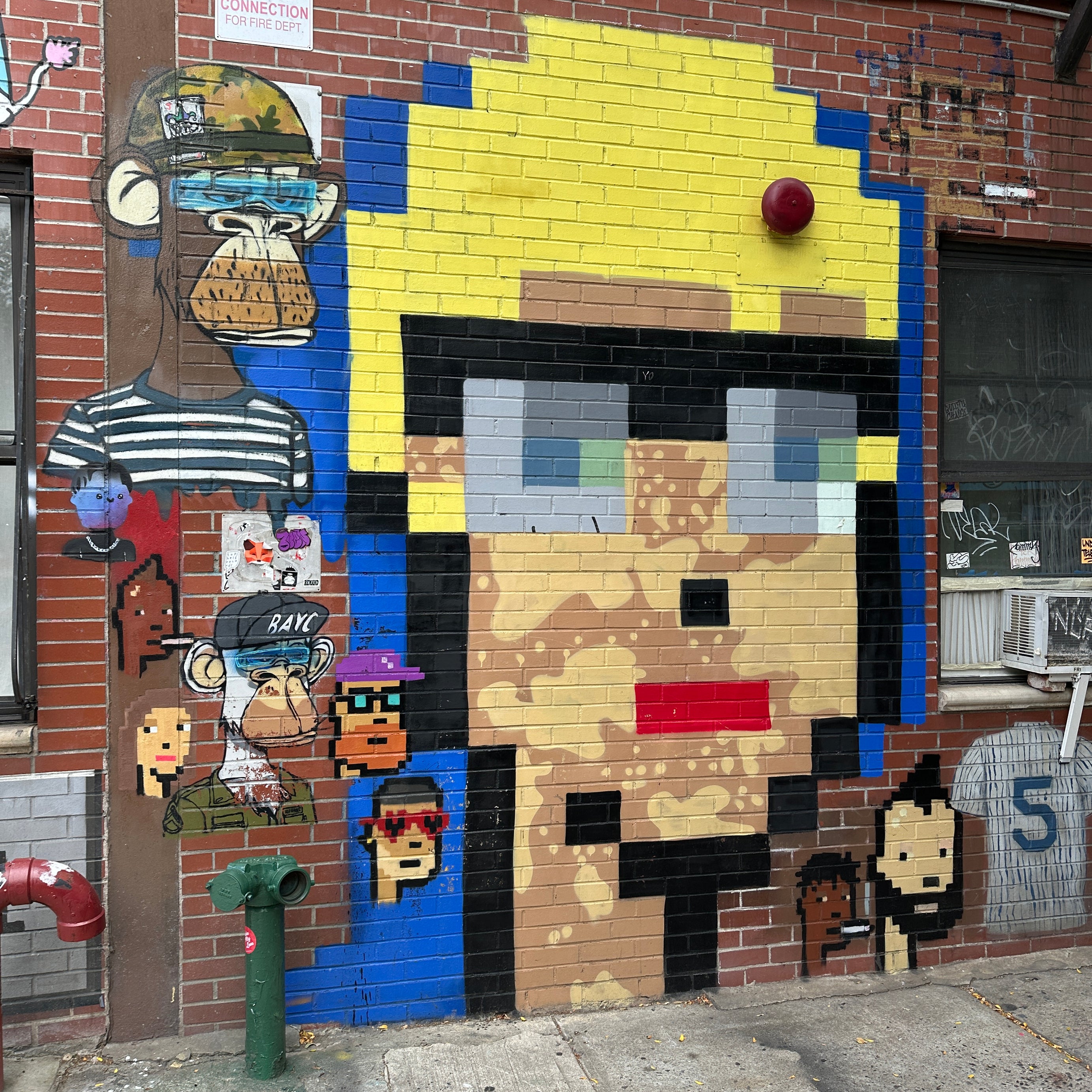 Participants using the Street Art Game app during the New York Team Building Street Art Walk to explore murals and compete in teams.