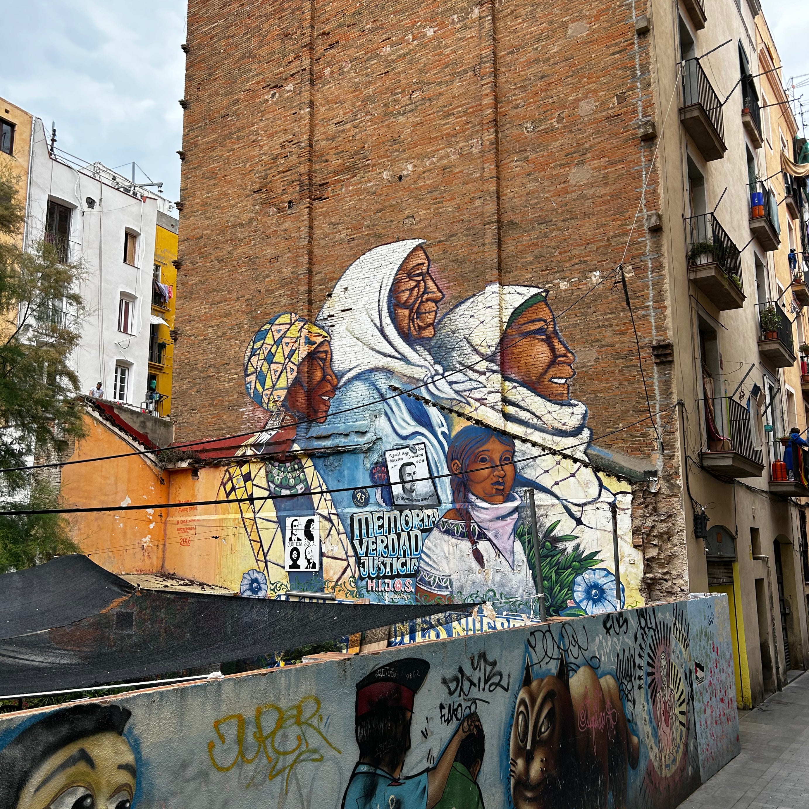 Textured shutter with color blocks photographed on the App-guided Street Art Tour Barcelona